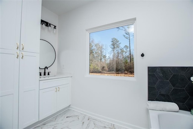 90 Ayers Rd, Bowdon, GA 30108 - bathroom featuring vanity, a tub to relax in, and marble look tile flooring