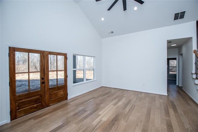 90 Ayers Rd, Bowdon, GA 30108 - unfurnished room featuring ceiling fan, high vaulted ceiling, french doors, wood finished floors, and stairway