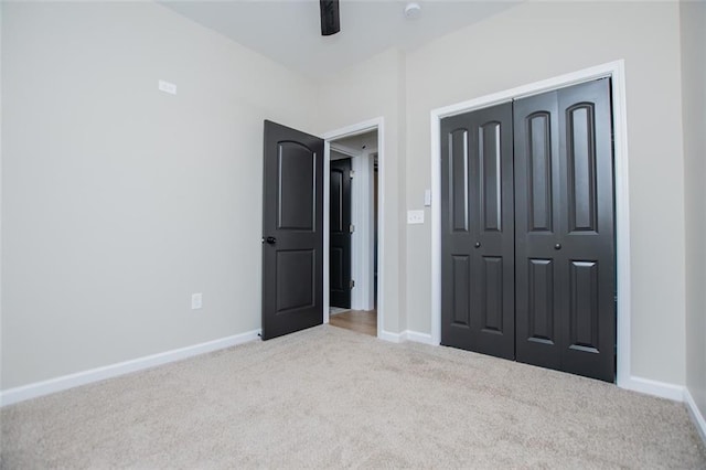 90 Ayers Rd, Bowdon, GA 30108 - unfurnished bedroom featuring carpet, a closet, and a ceiling fan