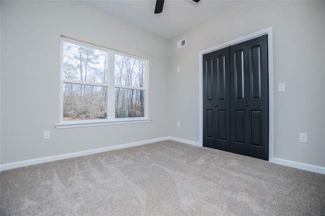 90 Ayers Rd, Bowdon, GA 30108 - unfurnished bedroom with carpet flooring, a closet, and ceiling fan