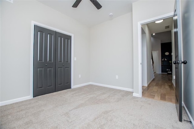 90 Ayers Rd, Bowdon, GA 30108 - unfurnished bedroom featuring carpet, a closet, and ceiling fan