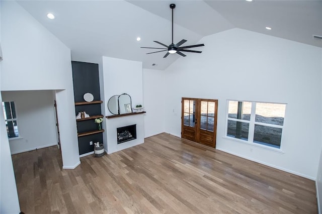 90 Ayers Rd, Bowdon, GA 30108 - unfurnished living room with french doors, a ceiling fan, wood finished floors, a fireplace, and recessed lighting