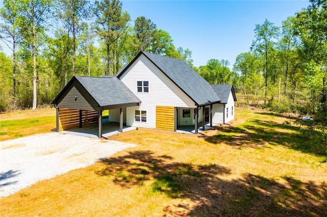 90 Ayers Rd, Bowdon, GA 30108 - view of front of house with gravel driveway and a carport