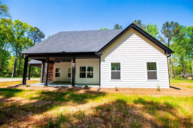 90 Ayers Rd, Bowdon, GA 30108 - rear view of house featuring a patio, a lawn, and roof with shingles