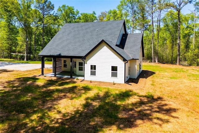 90 Ayers Rd, Bowdon, GA 30108 - back of property featuring a shingled roof and a yard