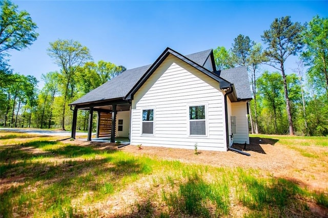 90 Ayers Rd, Bowdon, GA 30108 - back of house featuring roof with shingles