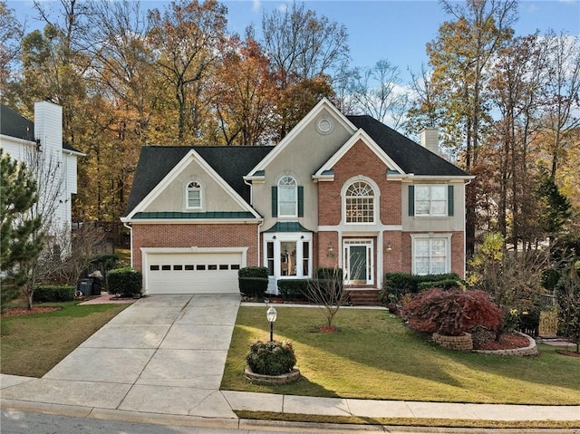 view of front of home featuring a garage and a front lawn