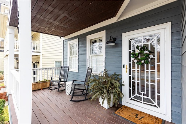 wooden terrace with a porch