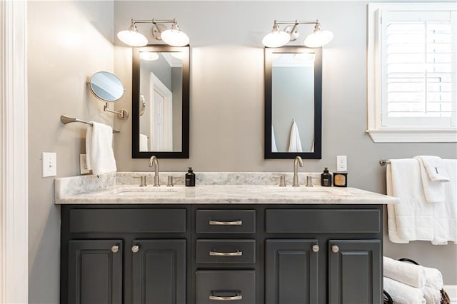 bathroom with double vanity and a sink