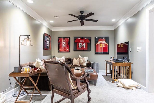 carpeted living room with visible vents, crown molding, baseboards, and ceiling fan