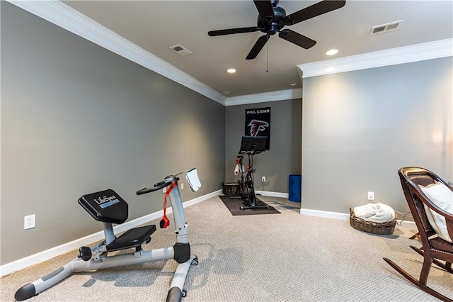 workout room with baseboards, visible vents, and ornamental molding