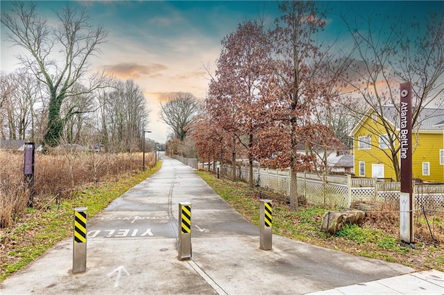 view of community with fence