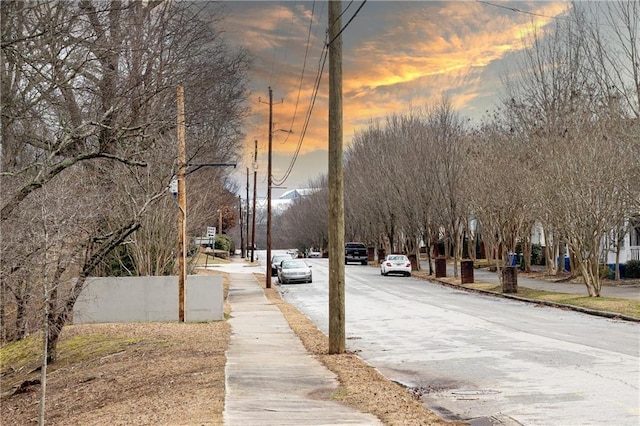 view of road with a residential view and sidewalks