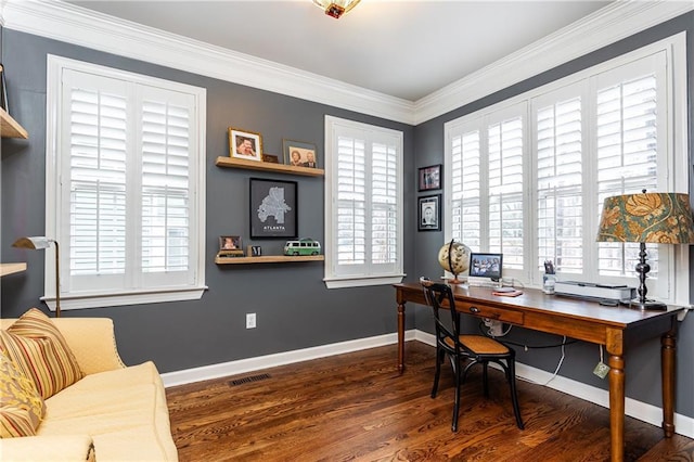 home office with ornamental molding, wood finished floors, visible vents, and baseboards