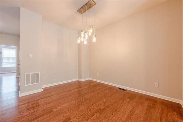 4404 Village Field Pl, Suwanee, GA 30024 - empty room featuring wood finished floors and baseboards