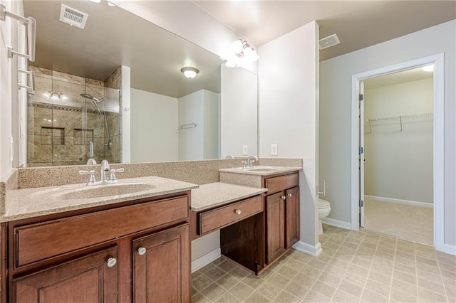 4404 Village Field Pl, Suwanee, GA 30024 - bathroom featuring a shower stall, double vanity, a spacious closet, and toilet