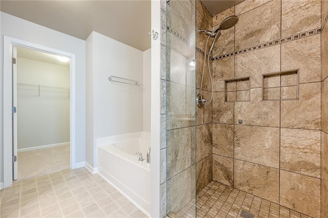 4404 Village Field Pl, Suwanee, GA 30024 - bathroom with a stall shower, a garden tub, and a walk in closet