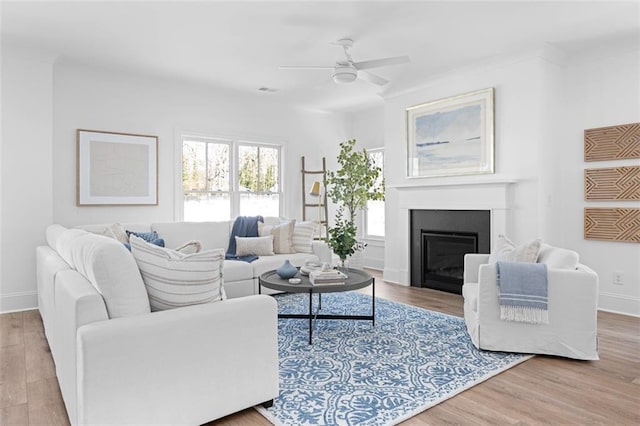 3317 Stillwood Ln, Hapeville, GA 30354 - living area featuring ceiling fan, a fireplace, baseboards, and wood finished floors