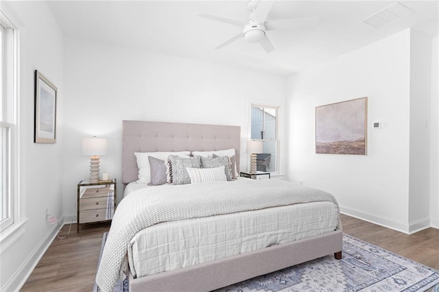 3317 Stillwood Ln, Hapeville, GA 30354 - bedroom with visible vents, wood finished floors, a ceiling fan, and baseboards
