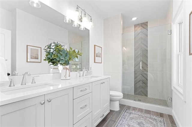 3317 Stillwood Ln, Hapeville, GA 30354 - full bathroom with wood finish floors, a sink, toilet, and a shower stall