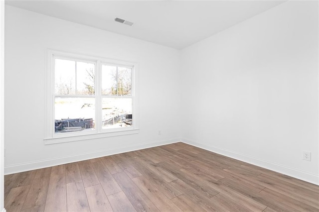 3317 Stillwood Ln, Hapeville, GA 30354 - empty room featuring wood finished floors, visible vents, and baseboards