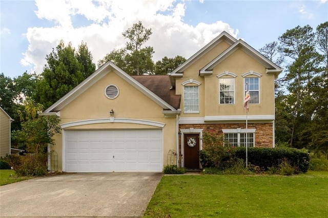 view of front facade with a garage and a front lawn