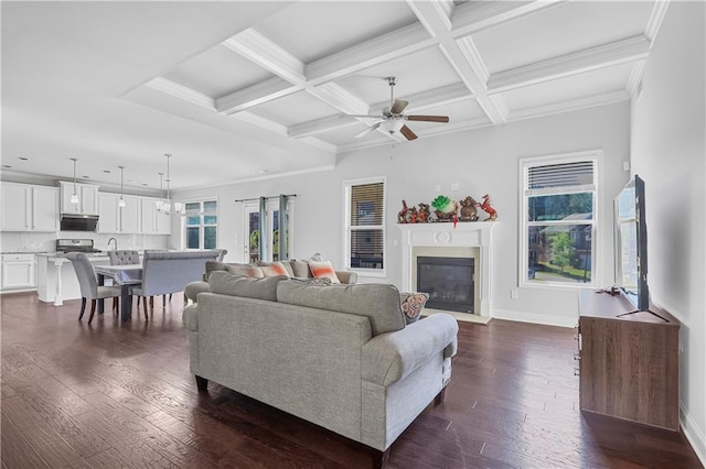 3259 Ivy Crossing Dr, Buford, GA 30519 - living area with a ceiling fan, baseboards, dark wood-style floors, beamed ceiling, and a glass covered fireplace