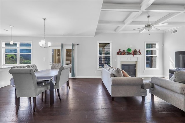 3259 Ivy Crossing Dr, Buford, GA 30519 - dining space featuring a chandelier, dark wood-type flooring, baseboards, beam ceiling, and a glass covered fireplace