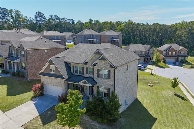 3259 Ivy Crossing Dr, Buford, GA 30519 - view of front of home featuring a residential view, a garage, driveway, and a front lawn