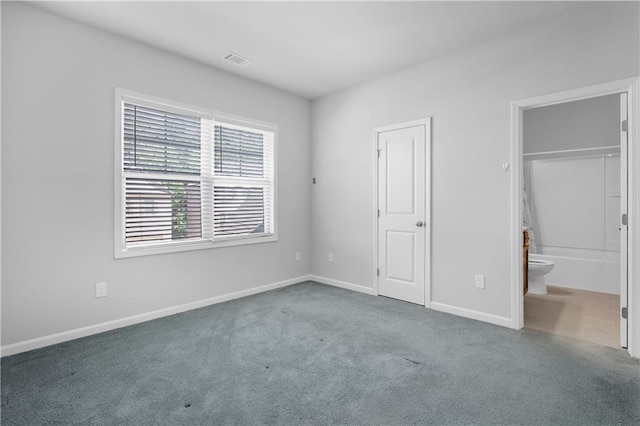 3259 Ivy Crossing Dr, Buford, GA 30519 - unfurnished bedroom with carpet floors, baseboards, and connected bathroom