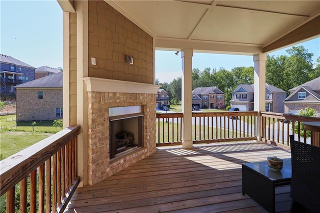 3259 Ivy Crossing Dr, Buford, GA 30519 - deck featuring an outdoor brick fireplace and a residential view