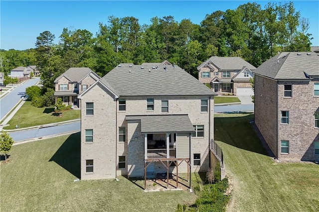 3259 Ivy Crossing Dr, Buford, GA 30519 - rear view of house with a residential view and a lawn