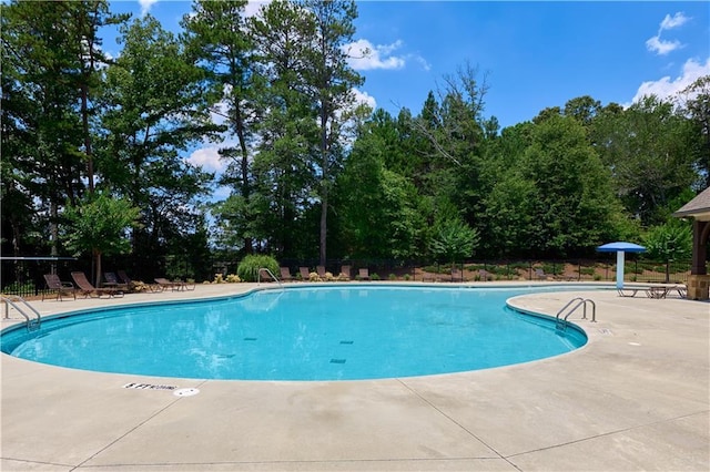 3259 Ivy Crossing Dr, Buford, GA 30519 - community pool with a patio area and view of wooded area