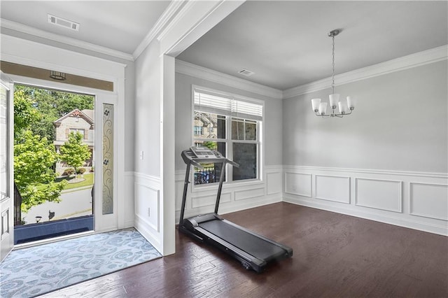 3259 Ivy Crossing Dr, Buford, GA 30519 - workout area with a chandelier, wood finished floors, wainscoting, and ornamental molding