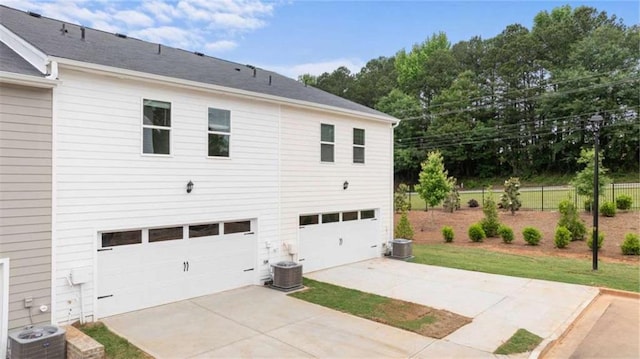 360 Sound Cir, Stockbridge, GA 30281 - back of property featuring a garage and driveway