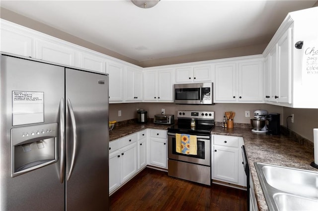 19 Autumn Pl NE, White, GA 30184 - kitchen featuring appliances with stainless steel finishes, white cabinets, and dark countertops