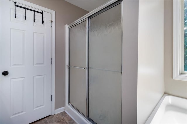 19 Autumn Pl NE, White, GA 30184 - full bath with a stall shower, a bathtub, and stone finish floors