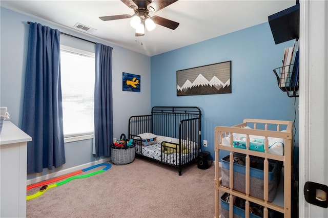19 Autumn Pl NE, White, GA 30184 - bedroom featuring a crib, carpet, and ceiling fan
