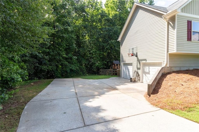 19 Autumn Pl NE, White, GA 30184 - view of property exterior featuring concrete driveway, an attached garage, and board and batten siding