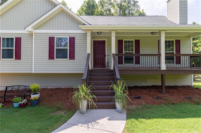 19 Autumn Pl NE, White, GA 30184 - view of front of property featuring board and batten siding, a chimney, a porch, and a front yard
