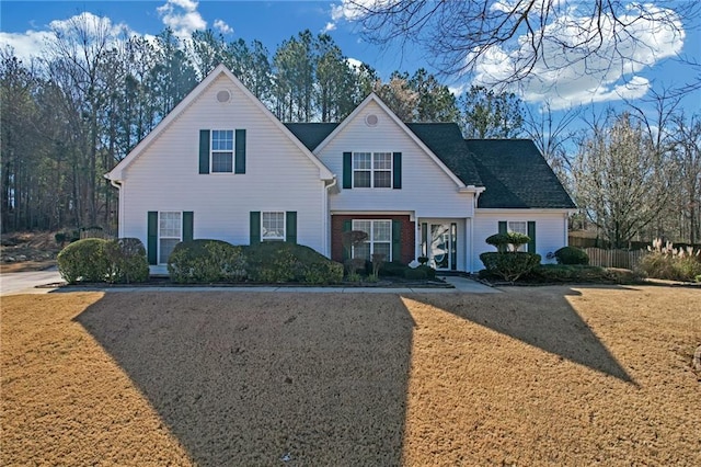 traditional-style home with a front yard