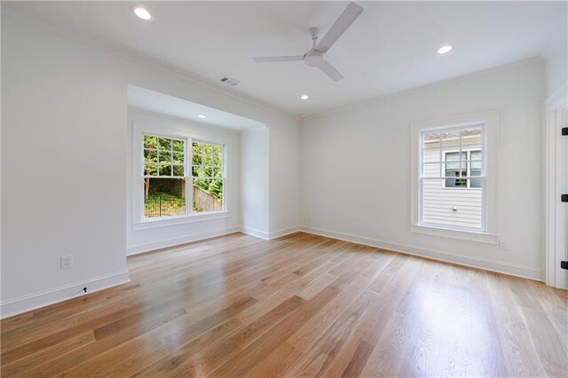 spare room with ceiling fan, light hardwood / wood-style flooring, and ornamental molding