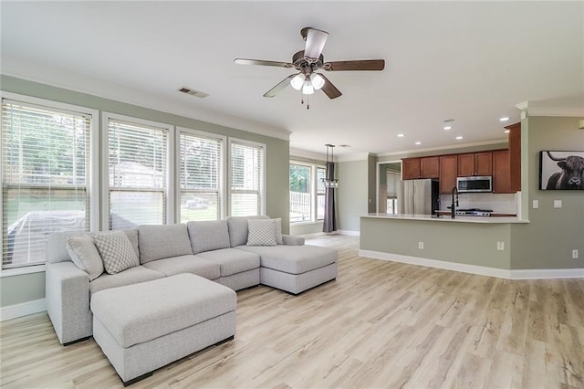 95 Jeffco Dr, Jefferson, GA 30549 - living room with crown molding, ceiling fan, baseboards, light wood-type flooring, and recessed lighting