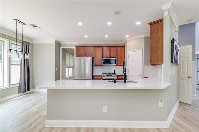 95 Jeffco Dr, Jefferson, GA 30549 - kitchen with stainless steel appliances, a sink, crown molding, healthy amount of natural light, and baseboards