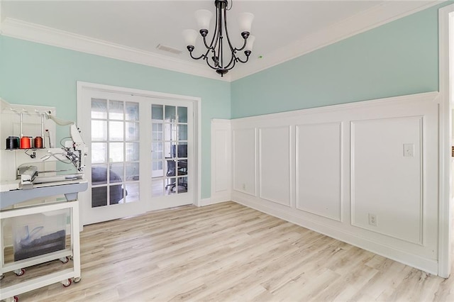 95 Jeffco Dr, Jefferson, GA 30549 - unfurnished dining area with ornamental molding, light wood finished floors, and a chandelier