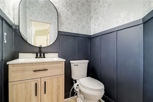 95 Jeffco Dr, Jefferson, GA 30549 - half bath with wallpapered walls, vanity, toilet, wainscoting, and a decorative wall