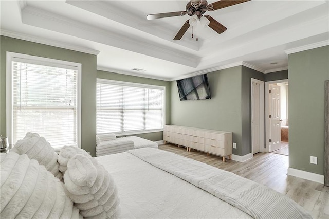95 Jeffco Dr, Jefferson, GA 30549 - bedroom with a raised ceiling, baseboards, light wood-style floors, ornamental molding, and ceiling fan