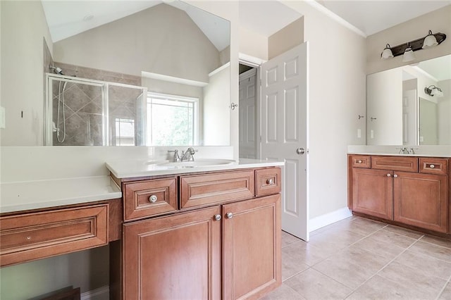 95 Jeffco Dr, Jefferson, GA 30549 - bathroom with a shower stall, two vanities, lofted ceiling, and tile patterned flooring