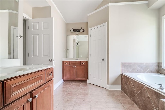 95 Jeffco Dr, Jefferson, GA 30549 - bathroom with two vanities, a garden tub, and tile patterned floors