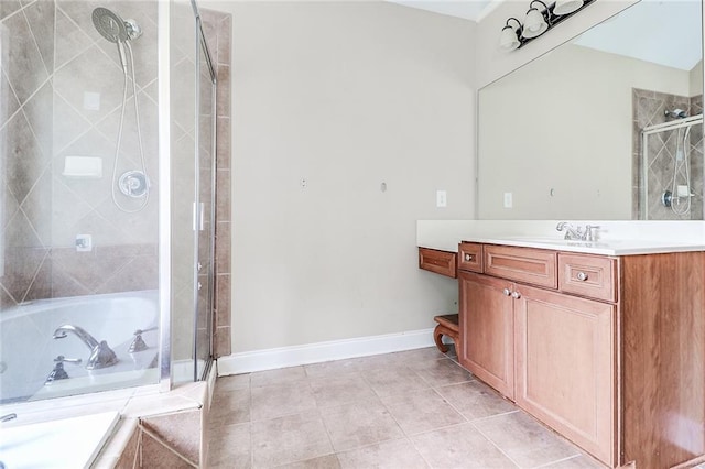 95 Jeffco Dr, Jefferson, GA 30549 - full bathroom featuring vanity, baseboards, a relaxing tiled tub, and a tile shower
